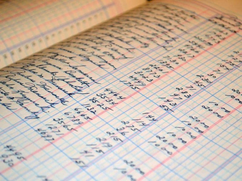 A handwritten bookkeeping ledger with columns of figures