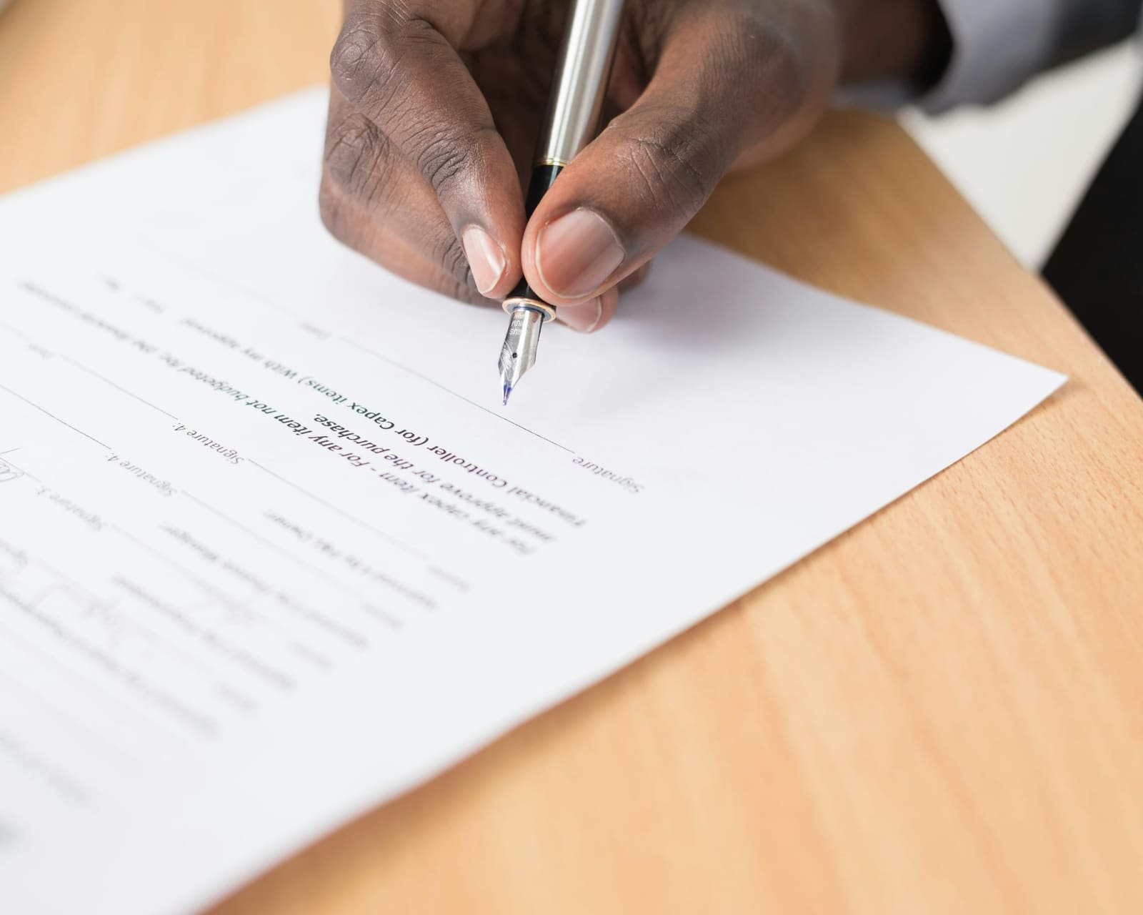 Client signing a fixed-fee bookkeeping engagement letter