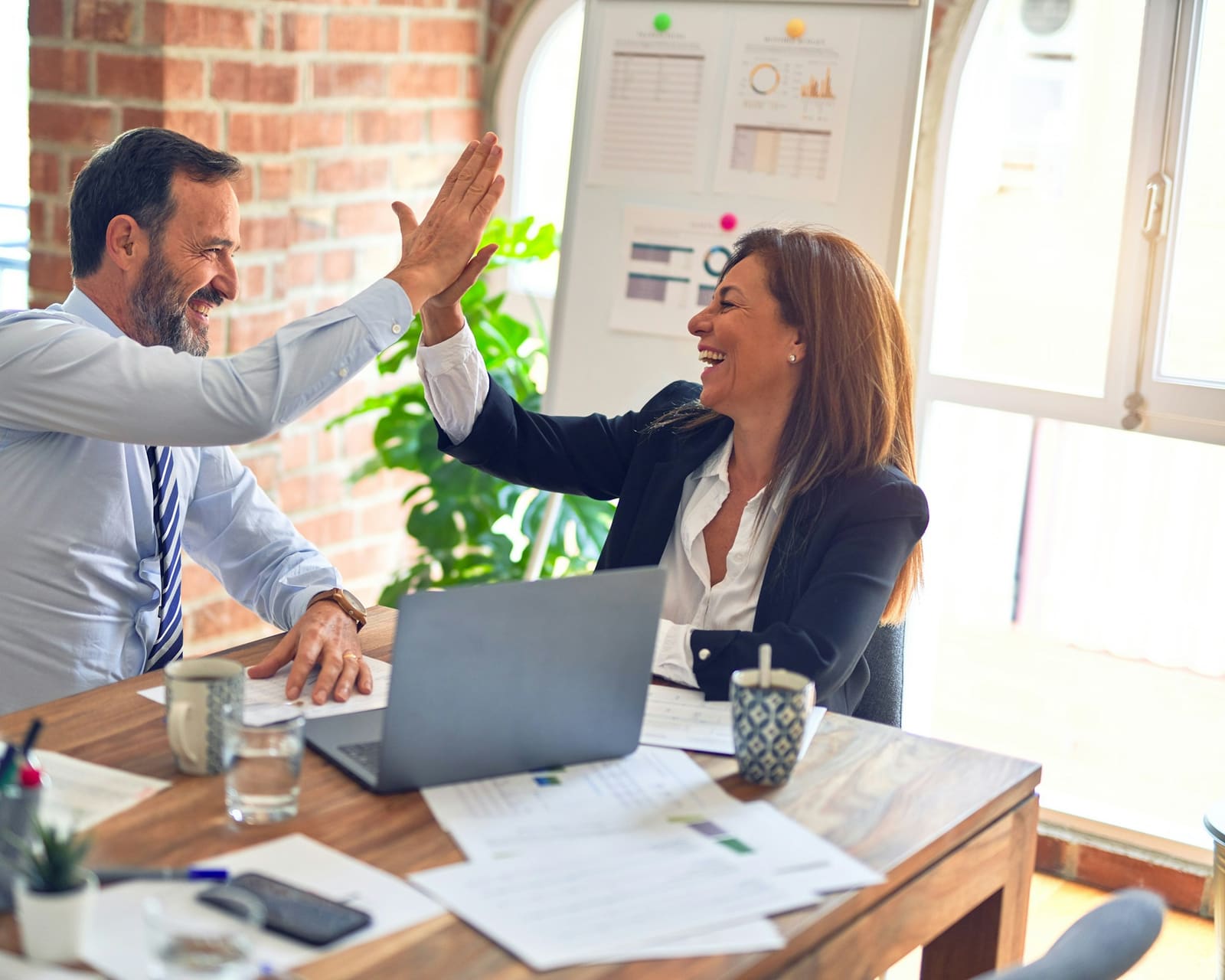 Business owner celebrating a result with their outsourced finance lead